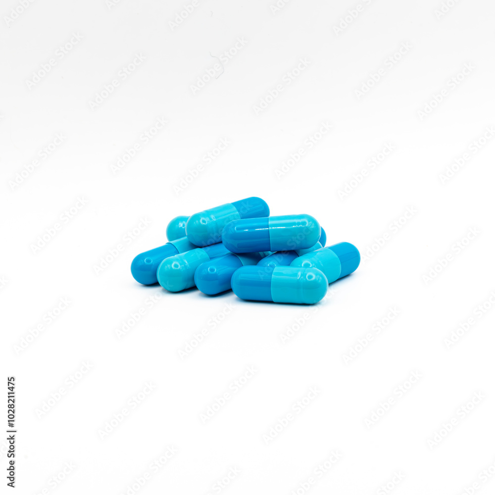 Blue medicine capsules on white background Blue medicine capsules on white background