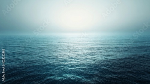 Calm Ocean Surface with a Misty Horizon