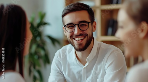 an employee showing enthusiasm while discussing ideas with a team 