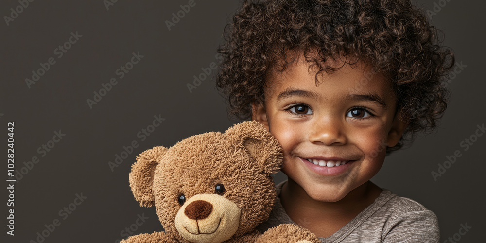 A boy with curly hair and brown eyes, smiling while holding a teddy bear, generative AI A boy with curly hair and brown eyes, smiling while holding a teddy bear, generative AI