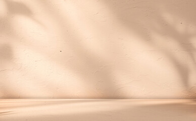 Empty beige background with sunlight superimposed shadow leaves on the wall. autumn background template for product presentation concept