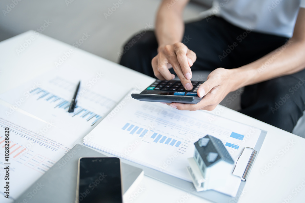 Man calculate finances home pay bills taxes savings economy financial at home Man calculate finances home pay bills taxes savings economy financial at home