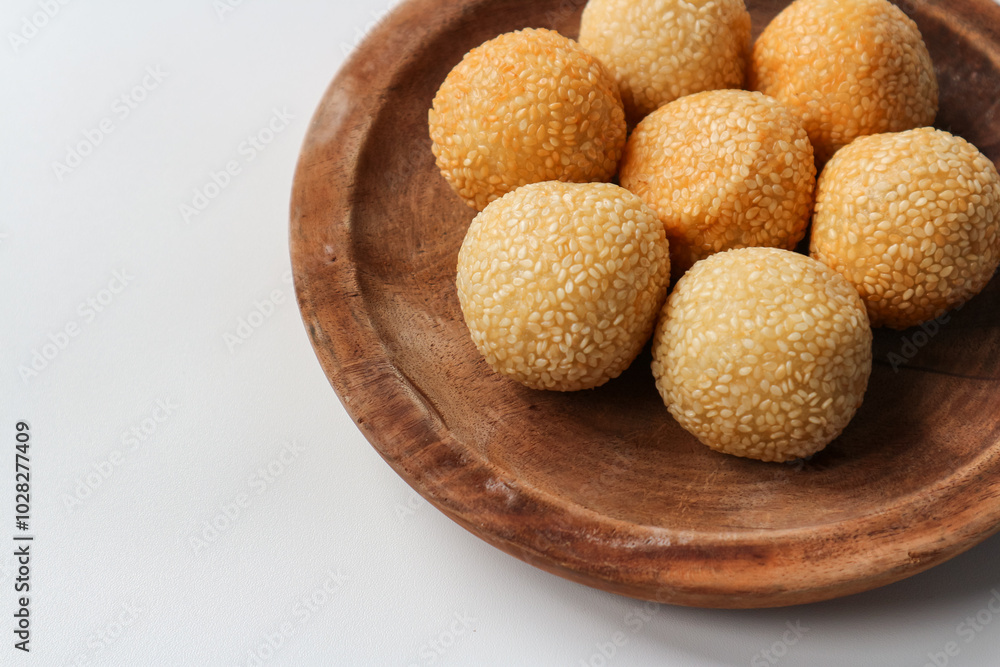 onde onde or sesame seed ball on a plate, popular traditional food in Indonesia onde onde or sesame seed ball on a plate, popular traditional food in Indonesia