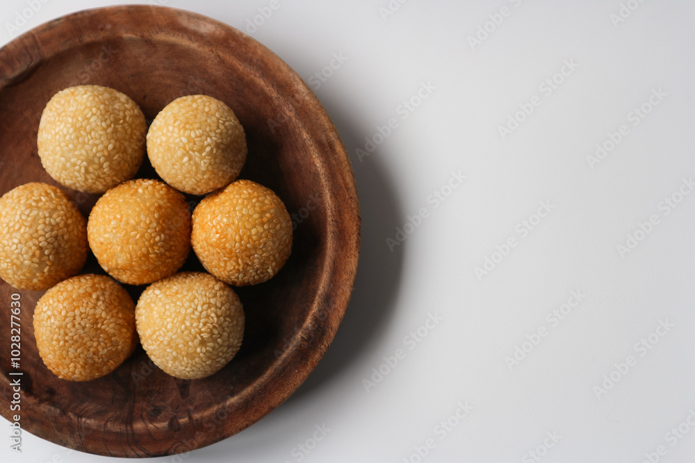 onde onde or sesame seed ball on a plate, popular traditional food in Indonesia onde onde or sesame seed ball on a plate, popular traditional food in Indonesia