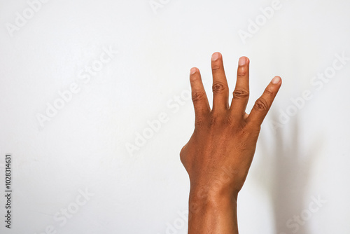 Indonesian hand with 4 open finger gesture