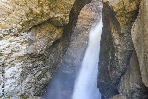 Trummelbach Falls are a series of ten glacier-fed waterfalls inside the mountain in Lauterbrunnen, Switzerland photo