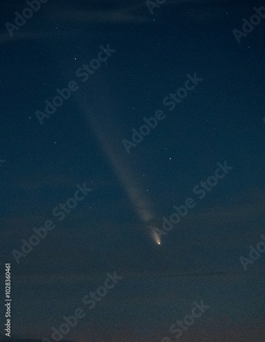 Comet Tsuchinshan-ATLAS pierces clouds over the Pacific Ocean