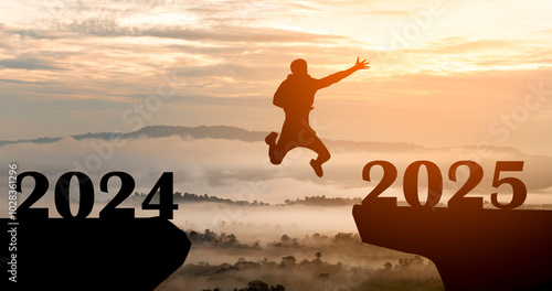 Silhouette of man jump from 2024 to 2025 at sunrise with mist cover moutain, new year,opportunity, hope and success concept	