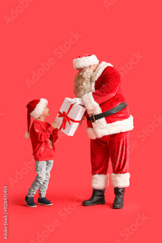 Santa Claus and cute little...