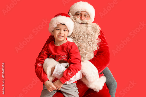Santa Claus and cute little...