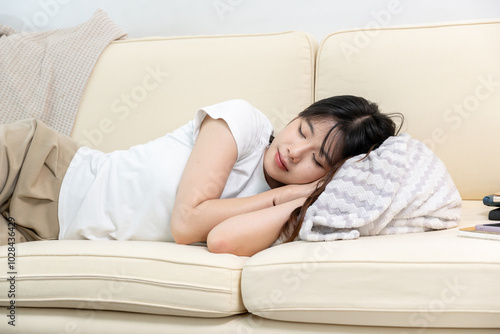 An Asian woman is taking a nap after a hard meeting.