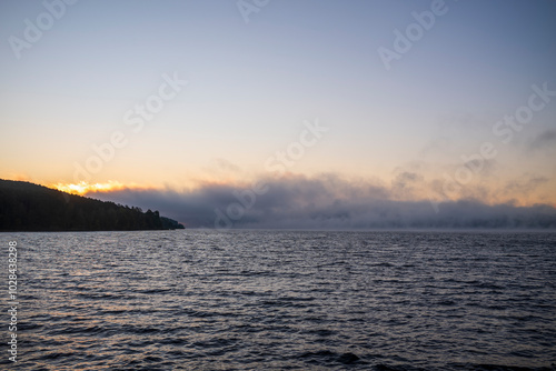 sunrise with fog over the lake