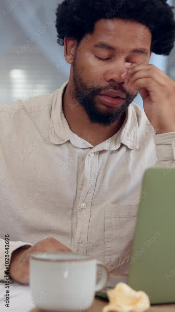 Allergy, sneeze and black man in home office with laptop, tissue and burnout from flu, cold or illness. Sick, exhausted and frustrated freelancer at desk blowing nose for health, risk and remote work