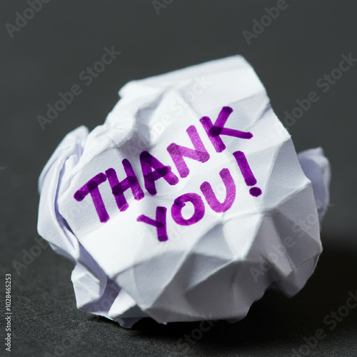 Crumpled paper with 'Thank ...