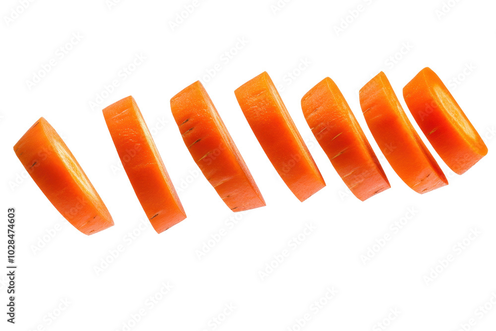 A carrot is sliced into six pieces, with the top and bottom pieces missing. Concept of motion and energy, as if the carrot is flying through the air
