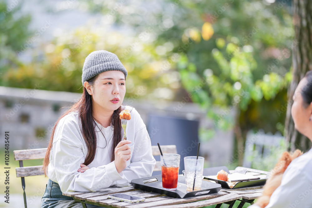 A Korean man and a Japanese woman, both in their 30s and a married couple, are enjoying an autumn brunch with three dogs at a stylish cafe located in Gyeongchun-ro, Namyangju-si, Gyeonggi-do, Korea. A Korean man and a Japanese woman, both in their 30s and a married couple, are enjoying an autumn brunch with three dogs at a stylish cafe located in Gyeongchun-ro, Namyangju-si, Gyeonggi-do, Korea.