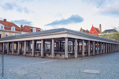 Old Fish market (Vismarkt) in Bruges, Belgium. Scenic cityscape with historical and architectural landmark located in the city center near the Groenerei canal, outdoor travel background photo