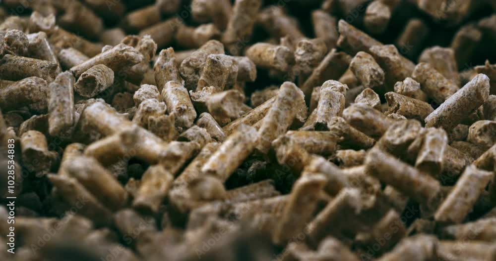 Super slow motion macro of renewable energy sources heating wood compressed pellets are mowing in pile of it for quality control at 1000 fps. Super slow motion macro of renewable energy sources heating wood compressed pellets are mowing in pile of it for quality control at 1000 fps.