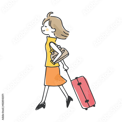 キャリーバッグを持って歩く女性