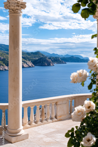White roses near stone balcony open to stunning sea view under clear sky.
