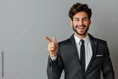 A man in a suit giving a thumbs up