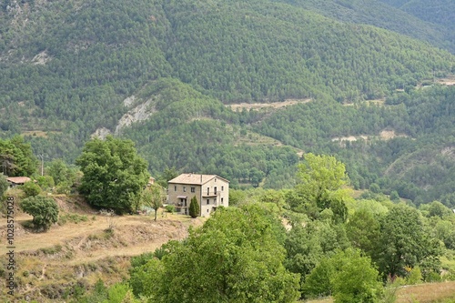 Wallpaper Mural Rural house nestled in lush green hills. Torontodigital.ca