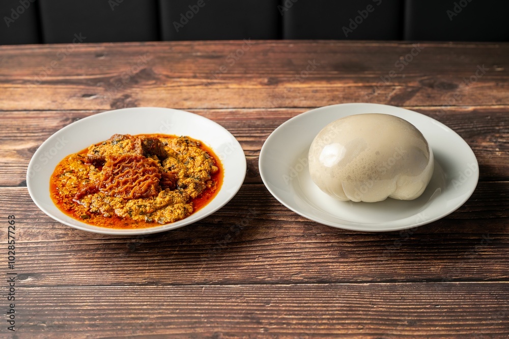 Traditional African egusi soup with pounded yam Traditional African egusi soup with pounded yam