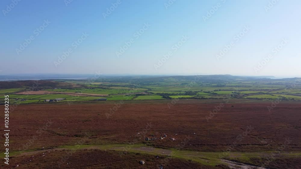 Pushing Aerial Shot Over Rhossili Down with Wide Path Trails and Square Farmed Green Fields and Hazy Blue Sky 4K Pushing Aerial Shot Over Rhossili Down with Wide Path Trails and Square Farmed Green Fields and Hazy Blue Sky 4K