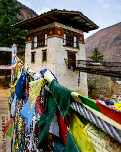 Prayer flags on Tachog Lhakhang Old Bridge. Chokha, Bhutan photo