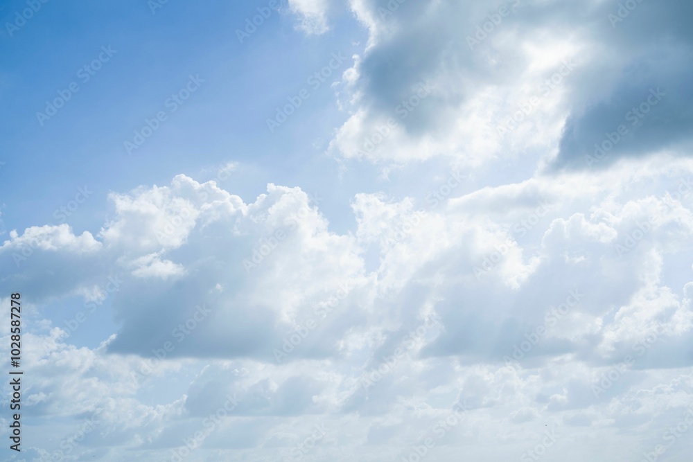 Serene sky with fluffy clouds on a sunny day Serene sky with fluffy clouds on a sunny day