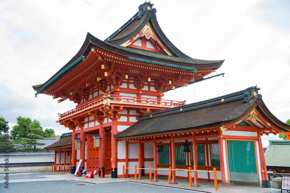 Intricate architecture and vibrant colors of the Fushimi Inari Shrine in Kyoto, Japan. Intricate architecture and vibrant colors of the Fushimi Inari Shrine in Kyoto, Japan.