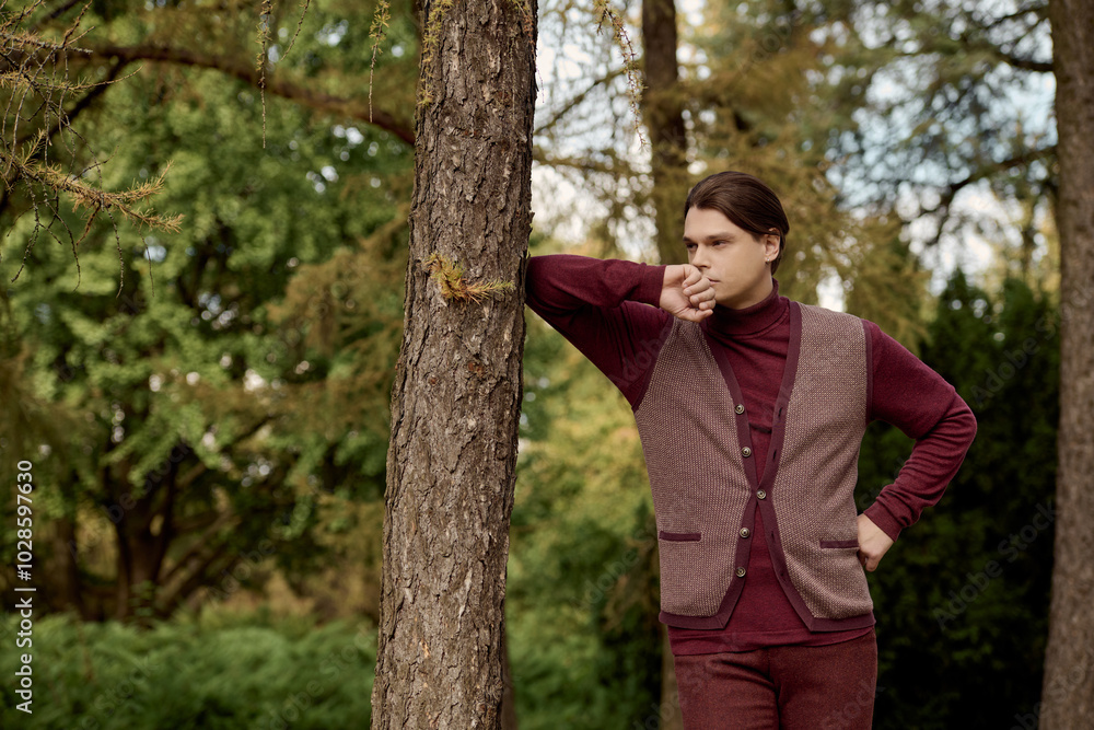 Handsome male model engaging with serene natural surroundings. Handsome male model engaging with serene natural surroundings.