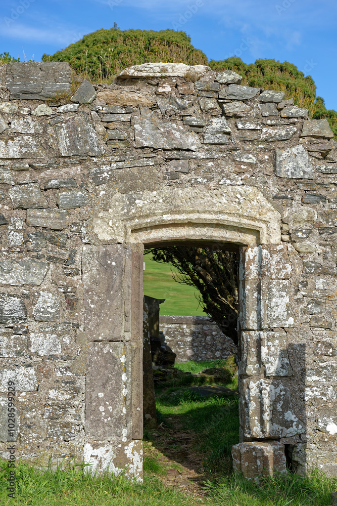 The Single doorway inset in the back wall of the ruins of Cowie Chapel with its distinctive carved stone lintel above. The Single doorway inset in the back wall of the ruins of Cowie Chapel with its distinctive carved stone lintel above.