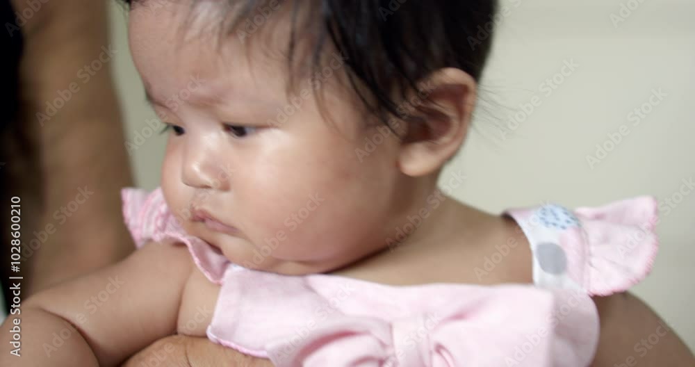 Asian newborn baby trying to move. Asian newborn baby trying to move.