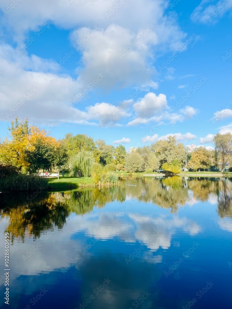 autumn trees reflection on the lake surface, blue lake reflection, golden autumn, lake in the park with quiet water as a mirror autumn trees reflection on the lake surface, blue lake reflection, golden autumn, lake in the park with quiet water as a mirror