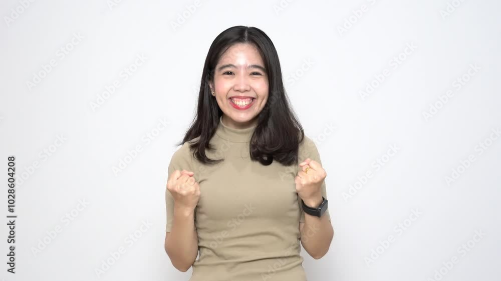 Beautiful Asian Woman doing Yes or excited gesture, WIN concept Isolated On White Background Beautiful Asian Woman doing Yes or excited gesture, WIN concept Isolated On White Background