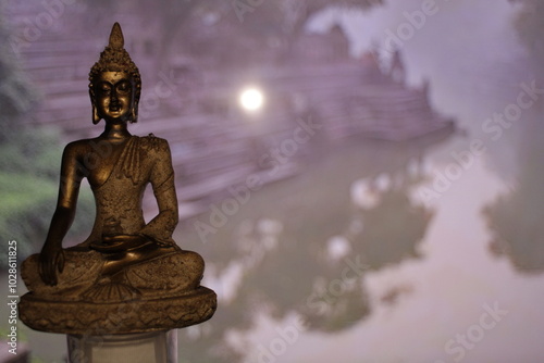 Earth Touching Buddha Statue with colorful backdrop with copy space, Bhumisparsha Buddha, Buddha in a seated meditation pose with his right hand touching the earth.  photo