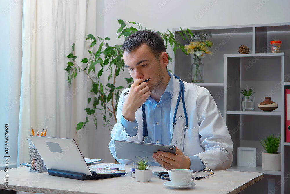 A young doctor, at his desk, receives patients. A young doctor, at his desk, receives patients.