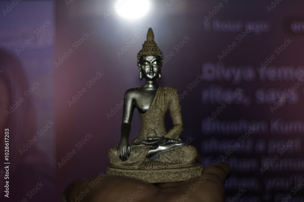 Serene Buddha Statue on empty colorful backdrop with copy space, yoga, meditation and relaxation time. Symbolizing peace and enlightenment. Serene Buddha Statue on empty colorful backdrop with copy space, yoga, meditation and relaxation time. Symbolizing peace and enlightenment.