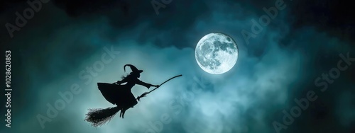 Silhouette of a Witch Flying on a Broomstick Against a Full Moon with Dark Mist and Colorful Fog, creepy halloween photo