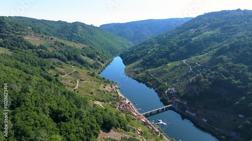 mountainside villages with a river near O Savinao Concello in the province of Lugo, Galicia, Spain photo