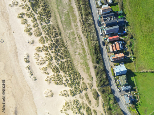 Aerial view of a row of detached houses, some used as second homes near a beach in Southwold on the suffolk coast. photo