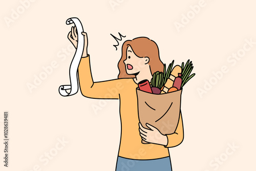 Huge bill for healthy food shocks woman who opens mouth, reading store receipt. Girl with bag healthy food products, disoriented due to sharp inflation of costs for organic fruits and vegetables.