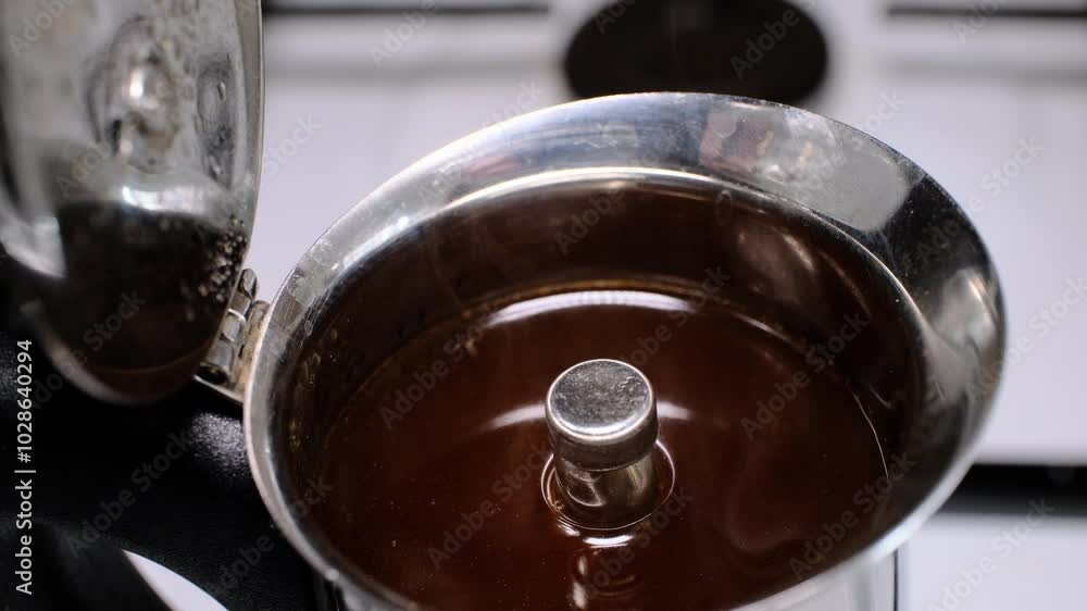 Brewing coffee with moka pot in close-up Brewing coffee with moka pot in close-up