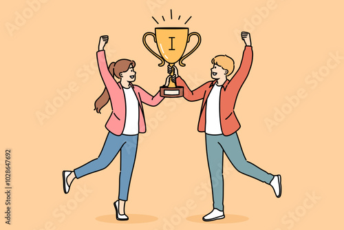 Joint victory of two schoolchildren, joyfully holding golden cup for participating in team intellectual game. Joint victory of children raising hands up after triumphant return from tournament