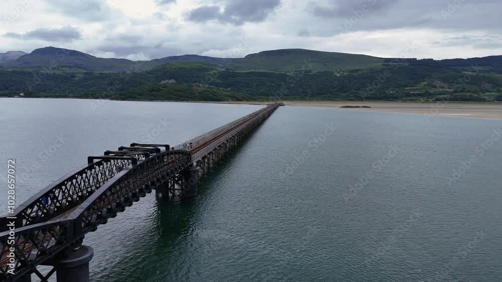 Aerial 4K drone video of Barmouth Viaduct bridge crossing the Mawddach Estuary, Gwynedd, North Wales Aerial 4K drone video of Barmouth Viaduct bridge crossing the Mawddach Estuary, Gwynedd, North Wales
