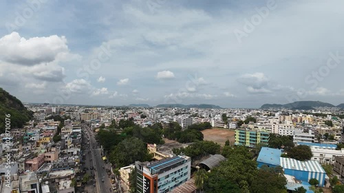 Drone view of rural Amaravathi’s highway, gound and farmlands under clear blue skies. photo