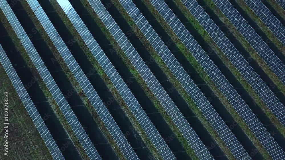 Aerial view of solar panels farm in the field. Drone footage. Aerial view of solar panels farm in the field. Drone footage.