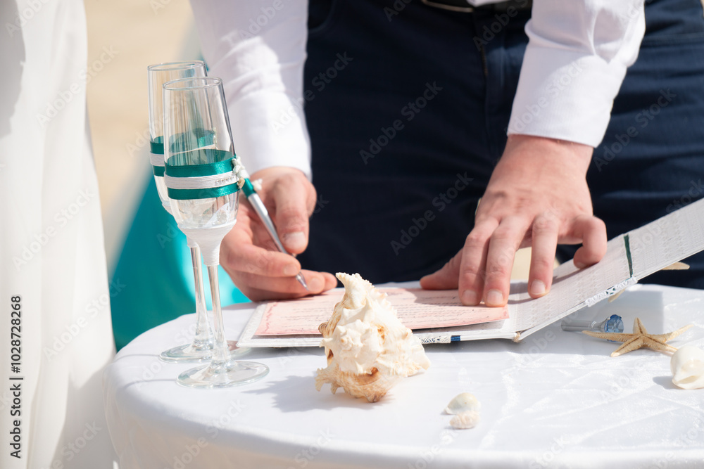 Decorations for wedding in the beach, Accessory kit bottles with sand for a wedding is on the table on the coastline of caribbean sea Decorations for wedding in the beach, Accessory kit bottles with sand for a wedding is on the table on the coastline of caribbean sea