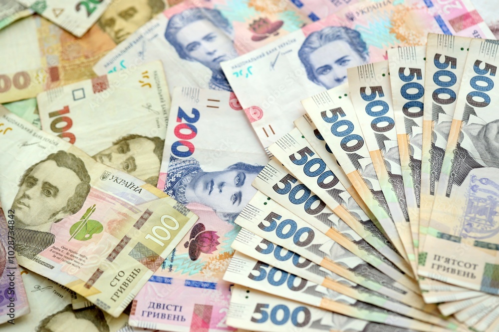 Big amount of different ukrainian hryvnia currency money bills in pile Big amount of different ukrainian hryvnia currency money bills in pile